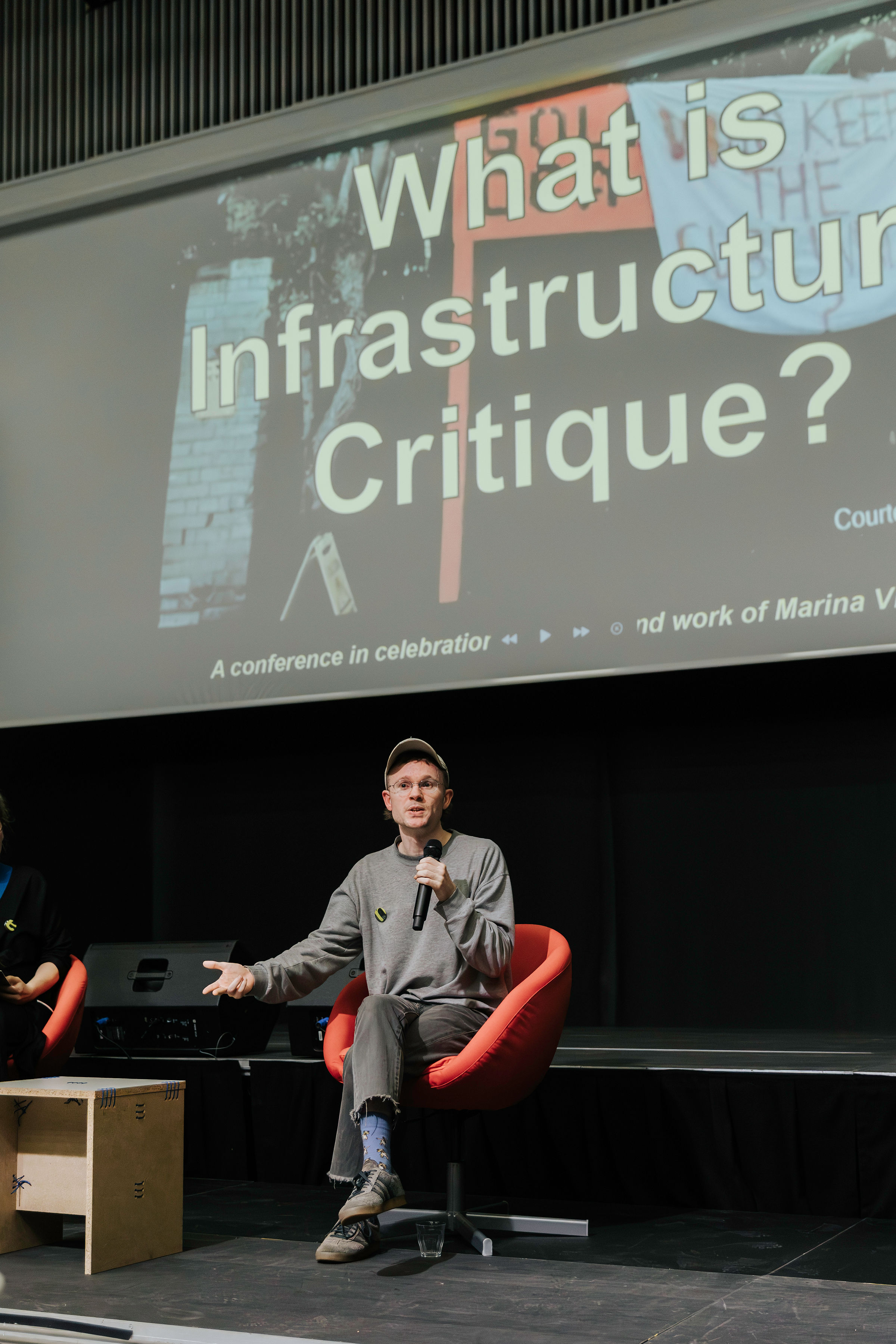 Danny Hayward speaking at the conference in celebration of the life and work of Marina Vishmidt, *What is Infrastructural Critique* 2025)